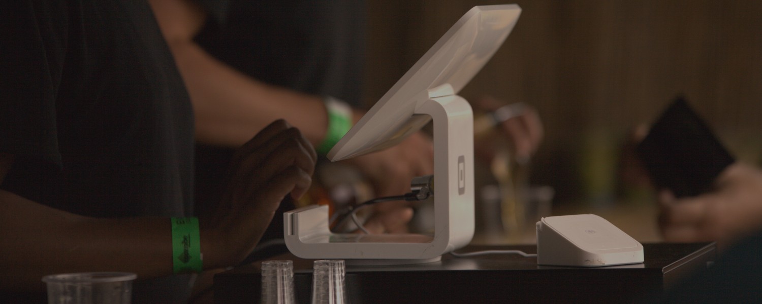 Event service area featuring a modern touchscreen POS system in use.