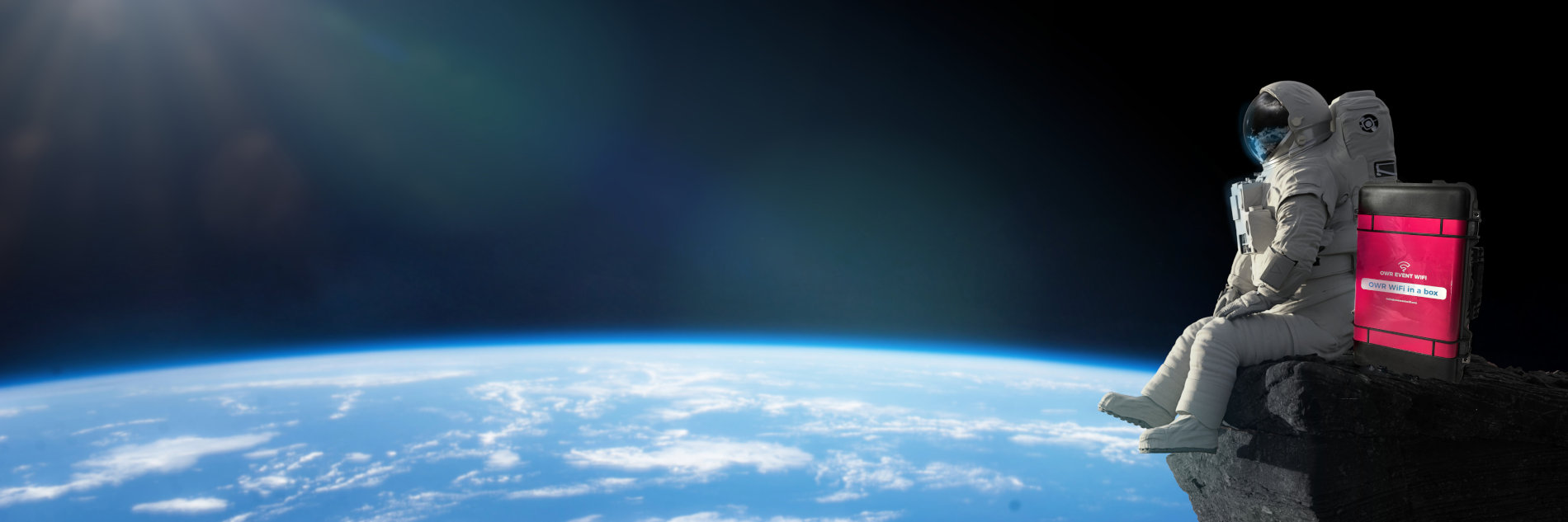 OWR WiFi in a Box device positioned beside an astronaut overlooking Earth from space.